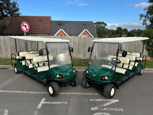 Two Cushman Shuttle 8 buggies with lithium batteries at a northern wedding venue.