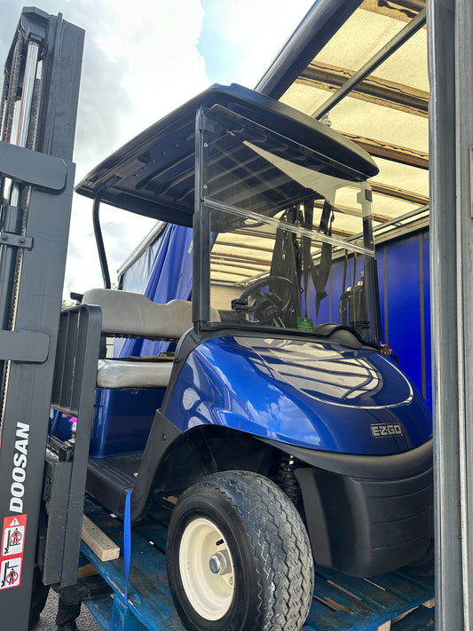Refurbished electric blue EZGO RXV ELiTE golf buggy delivered to a Scottish golf club.