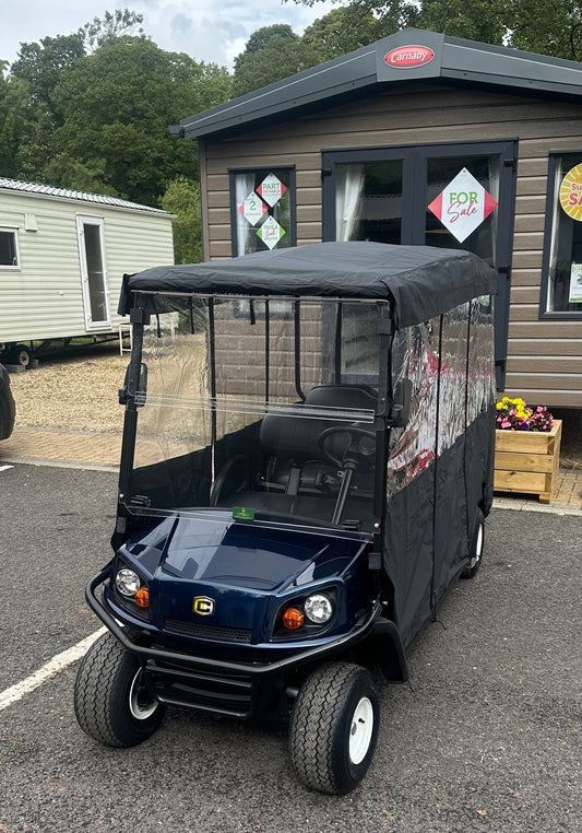 Cushman Shuttle 6 with lithium battery and weather enclosure at a northern caravan park.
