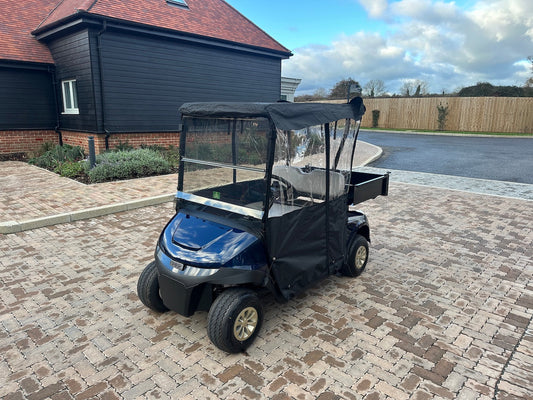 New EZGO RXV ELiTE with cargo box and weather enclosure delivered to a retirement village maintenance team.